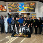 New Golden Chick Houston team members celebrate the opening of the new store